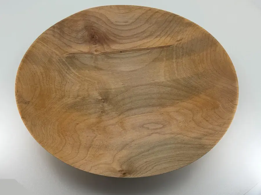 Hand-turned maple dish with subtle grain patterns, finished with walnut oil and wax