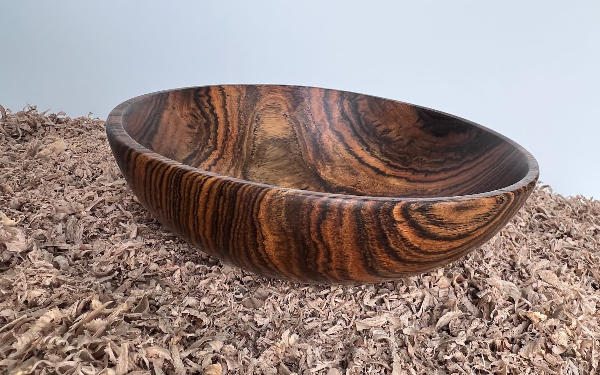 Hand-turned bocote wood bowl with natural grain patterns, finished with walnut oil and wax